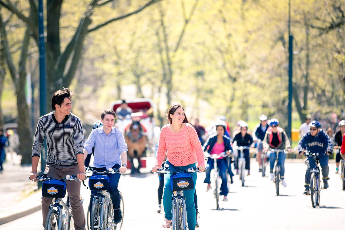 Group of young people riding bikes in USA.