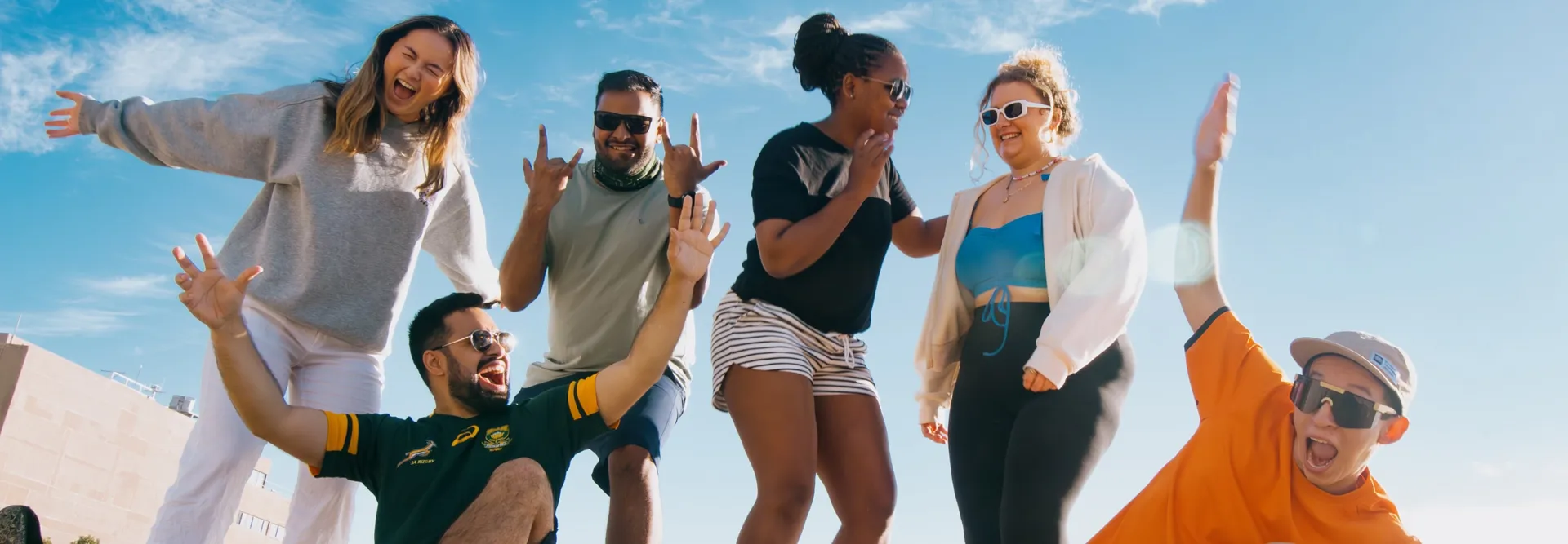Group of young travellers enjoying the sea side in South Africa