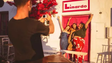 A group of youngsters clicking pictures while having fun in Greece.