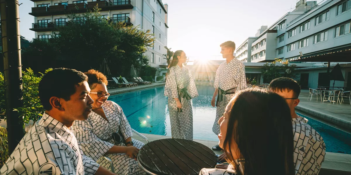 Group Talking By The Pool