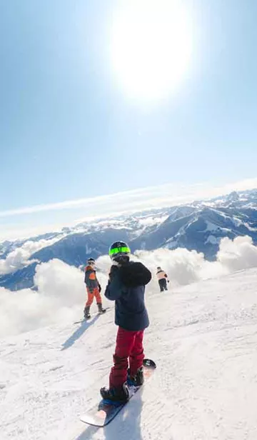 Snowborders On The Slopes In Austria
