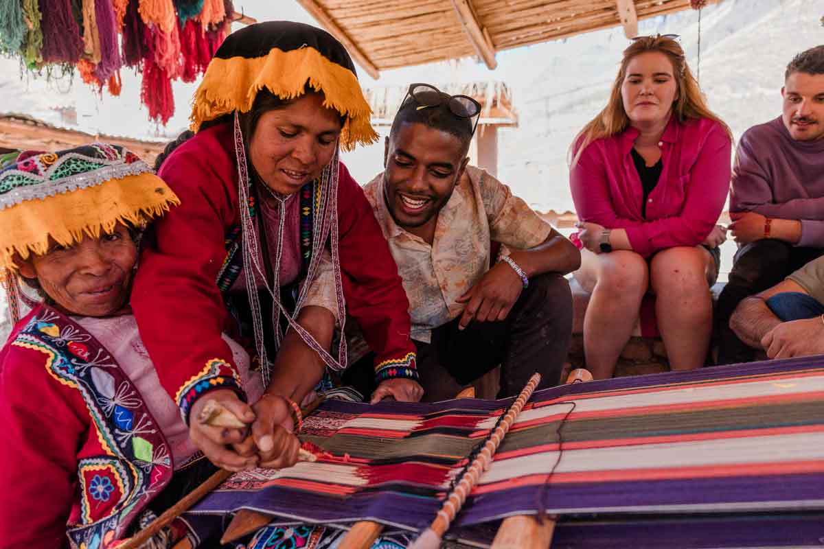 Group Of Locals And Traveler In Peru