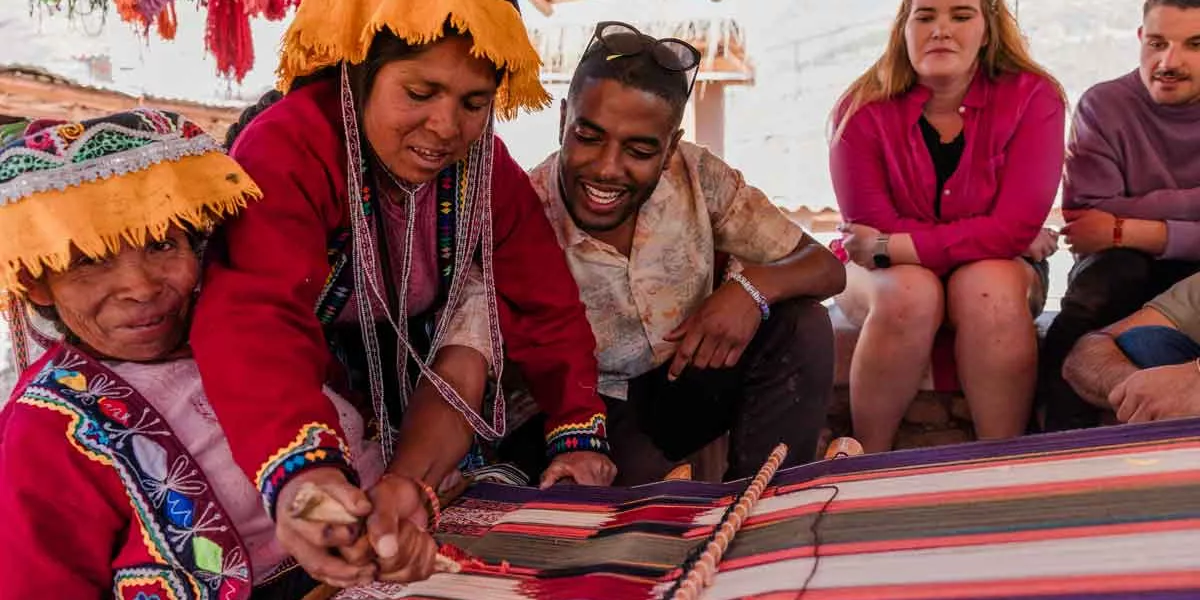 Group Of Locals And Traveler In Peru
