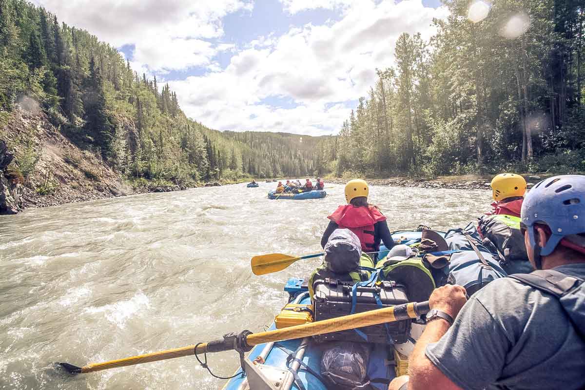 People Enjoying A Rafting Adventure