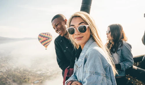 a group of friend flying in a baloon