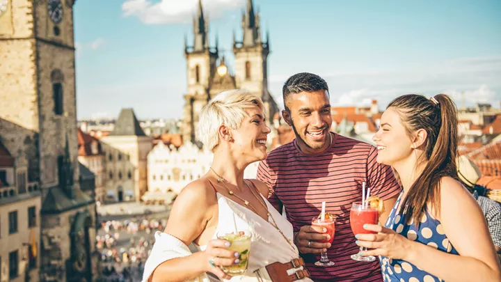 Rooftop cocktails in front of the Church of our Lady before Tyn in Prague, Czech Republic