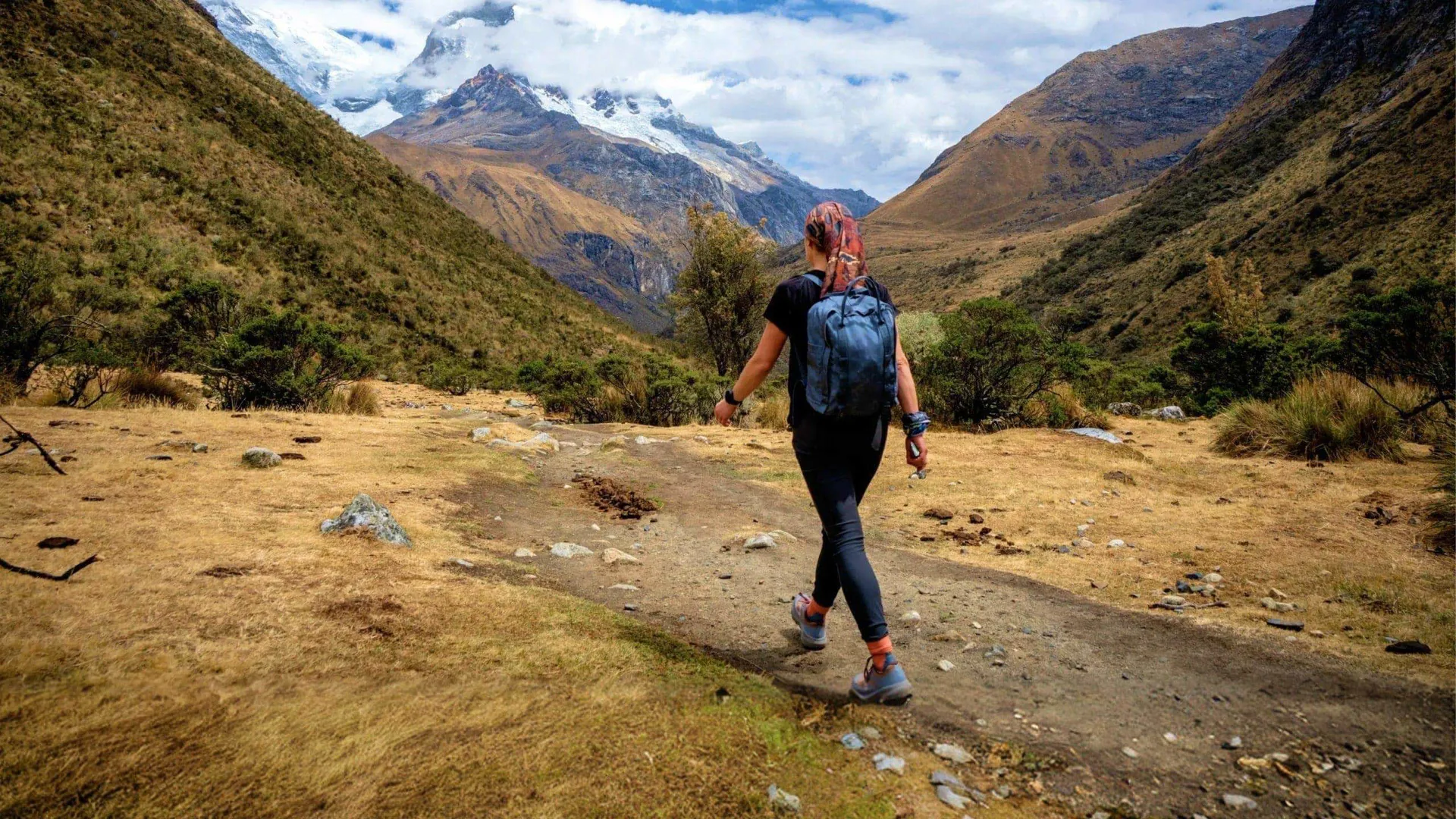 Traveller hiking through the Andes near Huaraz, Peru, on the Contiki Active Peru: Lima to Huaraz Tour