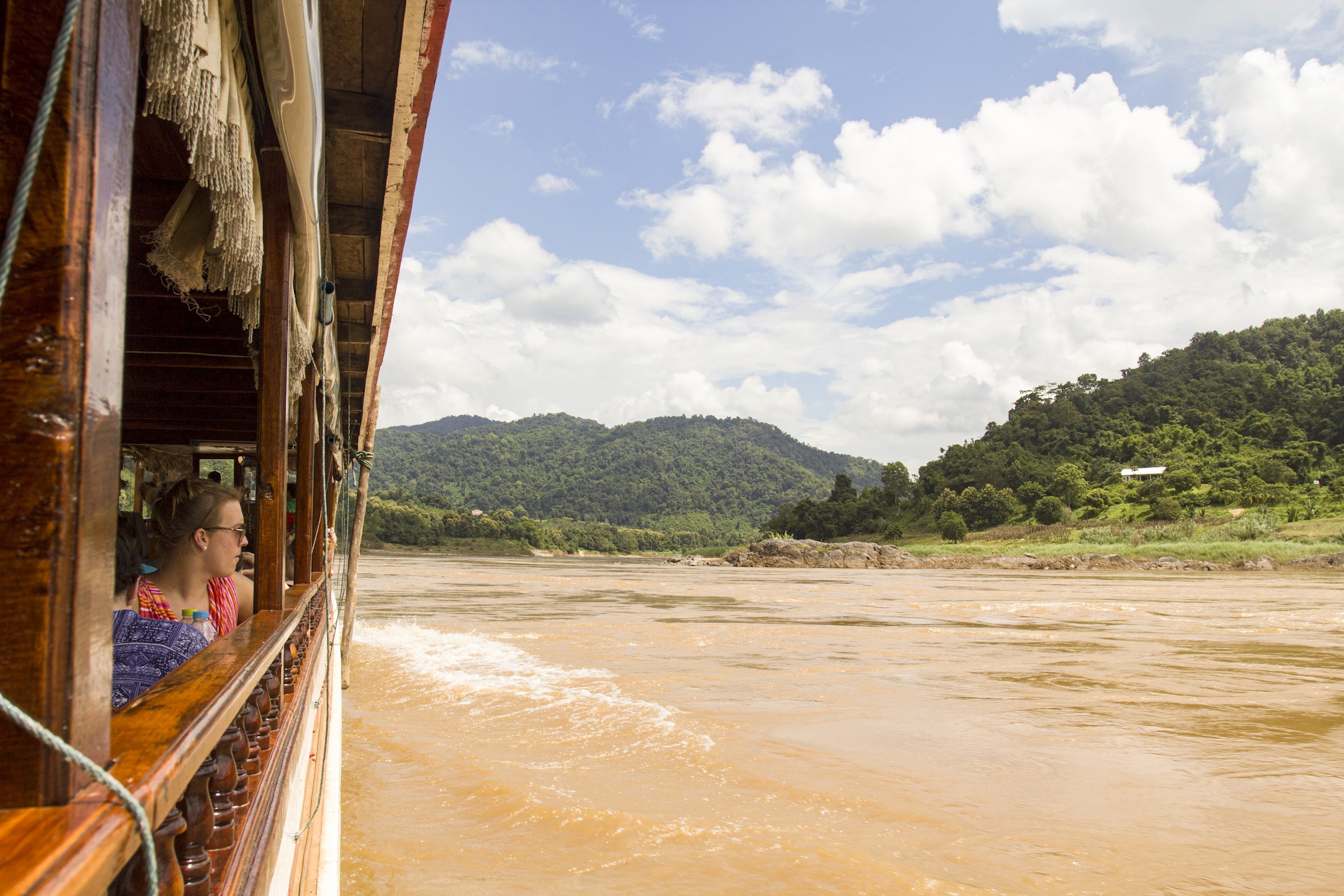 Travellers on a boat on the Mekong River in Pak Beng, Laos