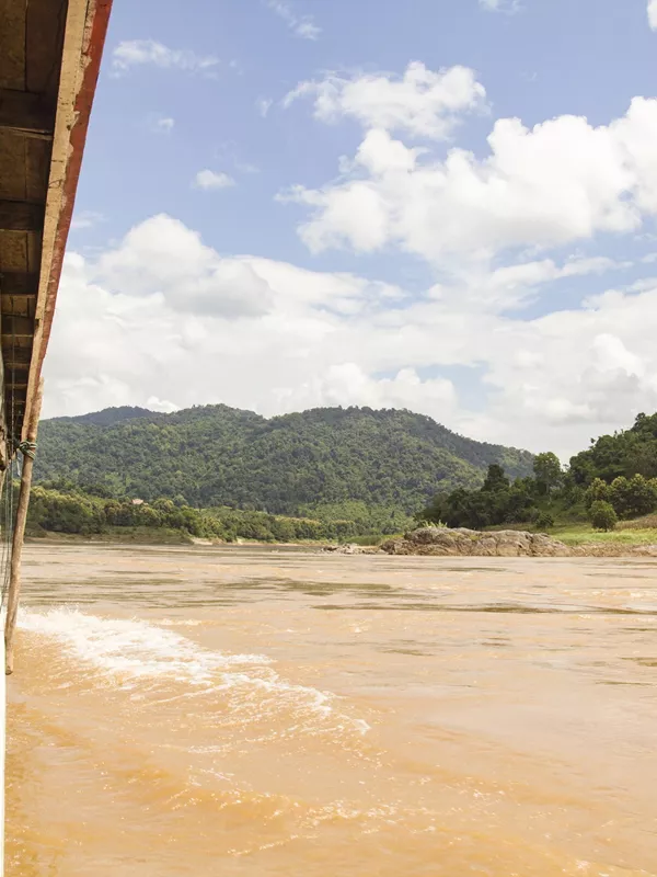 Travellers on a boat on the Mekong River in Pak Beng, Laos