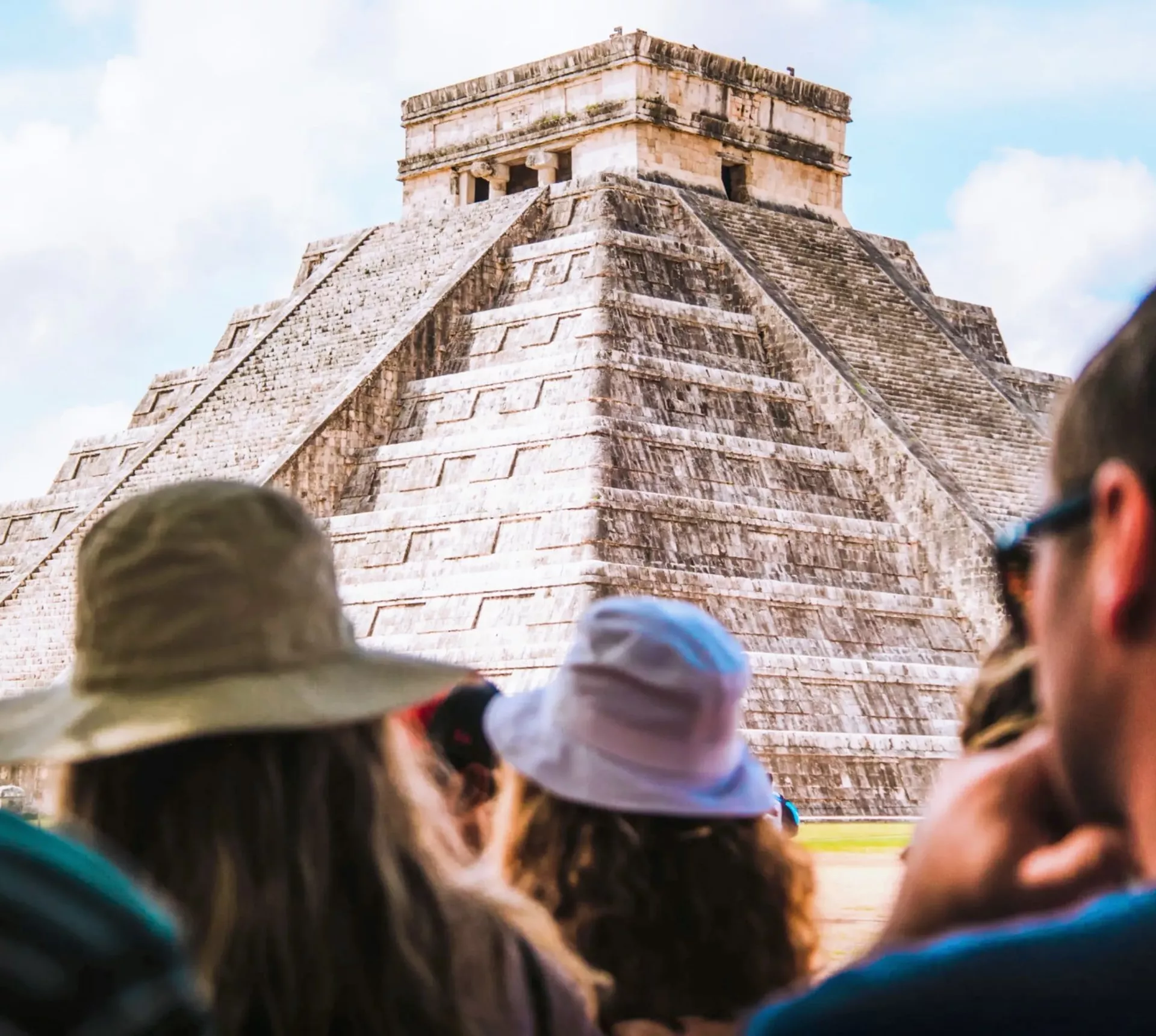 Travellers admire El Castillo at Chichén Itzá on Contiki's Mexico City to Tulum Tour
