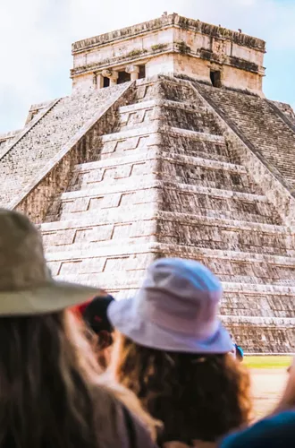 Travellers admire El Castillo at Chichén Itzá on Contiki's Mexico City to Tulum Tour