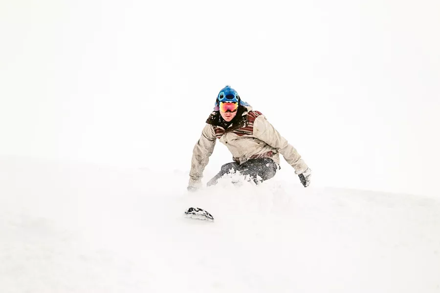 Person Snowboarding Deep Snow
