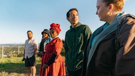 A group of people standing in a field