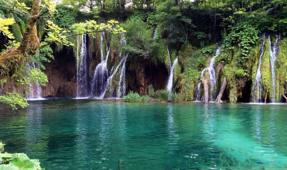 Beautiful Lake Surrounded By Mountains And Trees