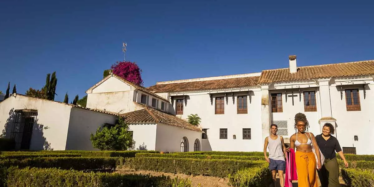Travelers Outside Villa In Portugal