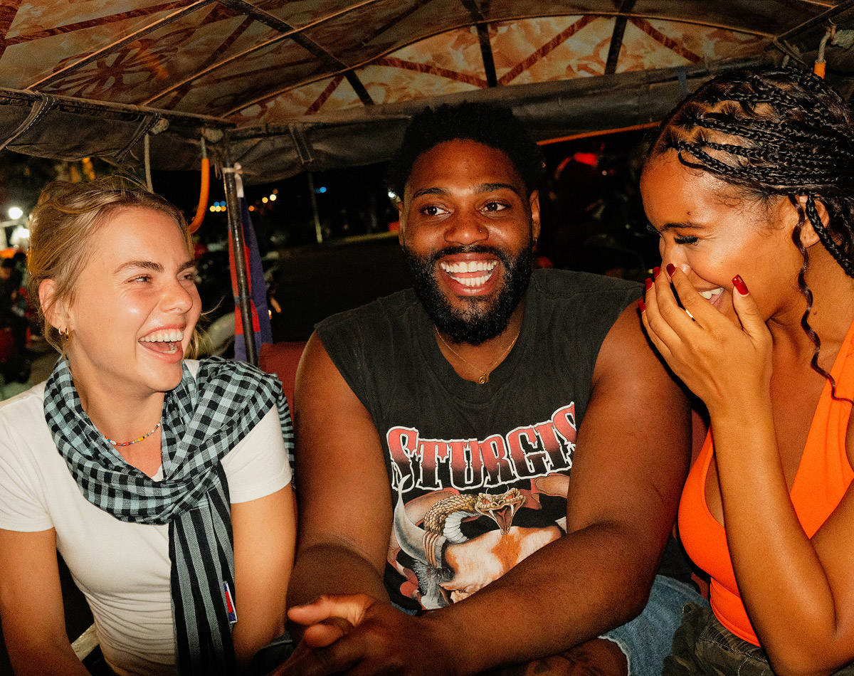 loyalty-card-travellers-laughing-back-of-tuktuk-night-siem-reap-cambodia.jpg