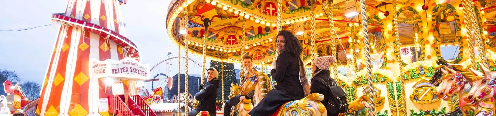 Group On Carousel At Christmas Market London