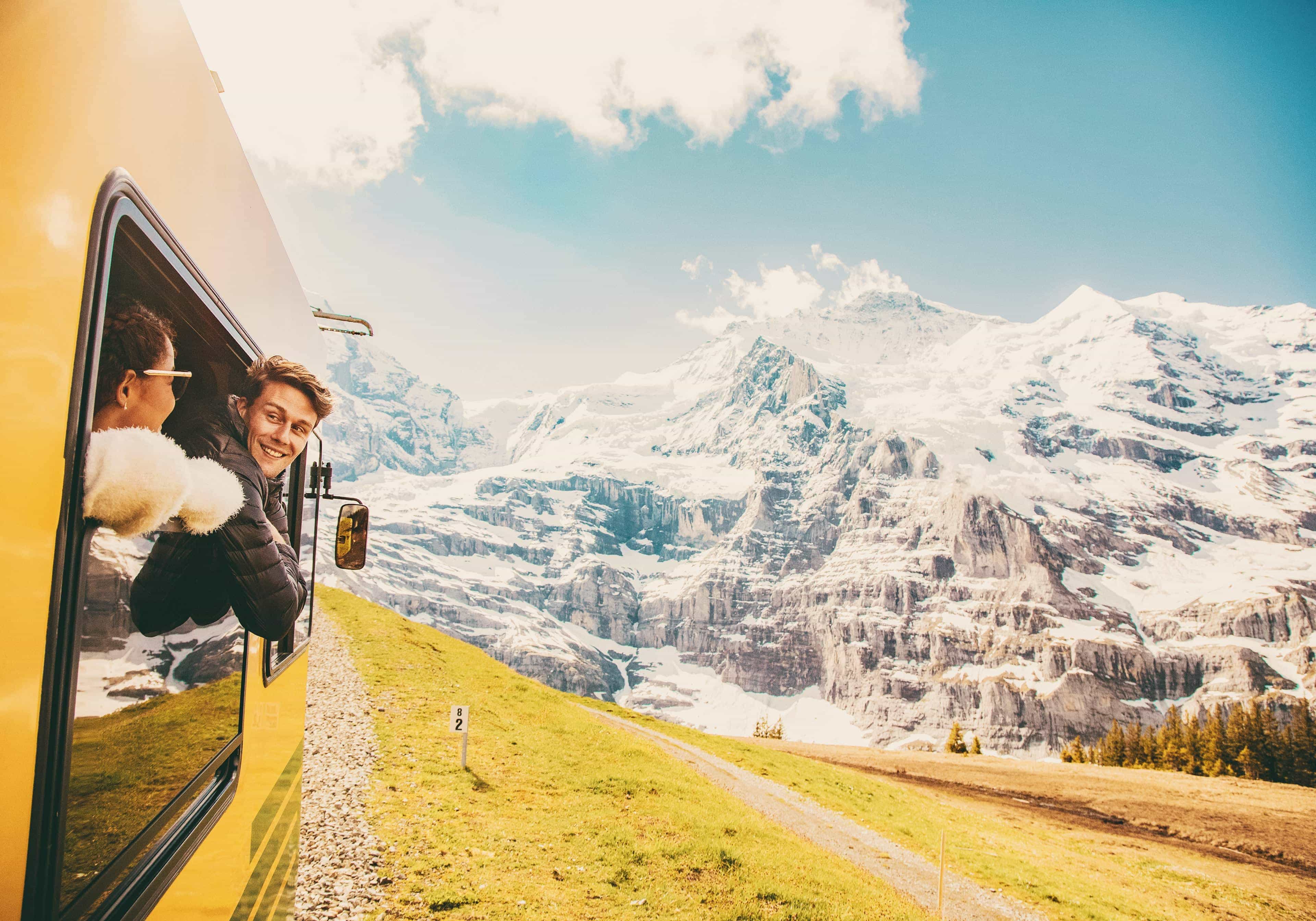 Couple Looking Out Window Train Switzerland Mountain 