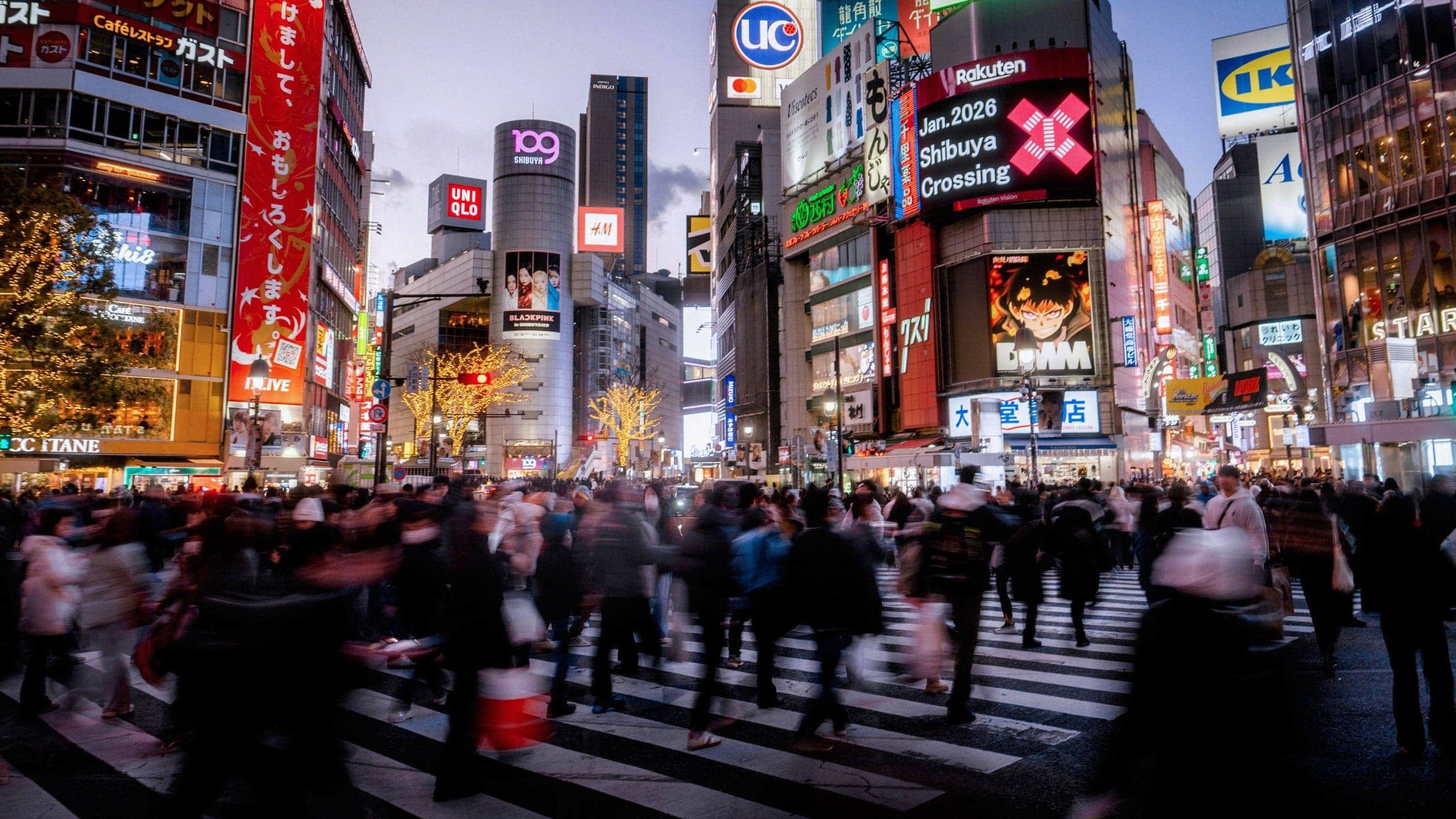Shibuya Crossing illuminated at night in Tokyo, Japan, on Contiki's Japan in a Week 35 to 45 Tour