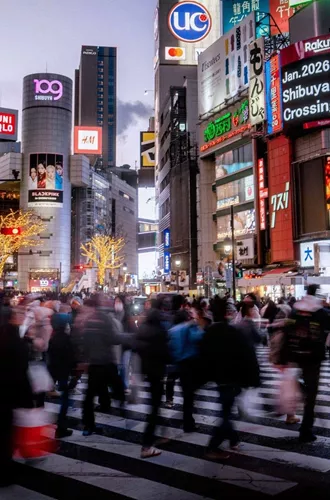Shibuya Crossing illuminated at night in Tokyo, Japan, on Contiki's Japan in a Week 35 to 45 Tour
