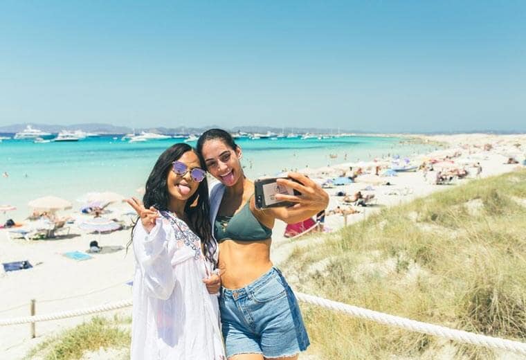 Girls taking a selfie on the beach