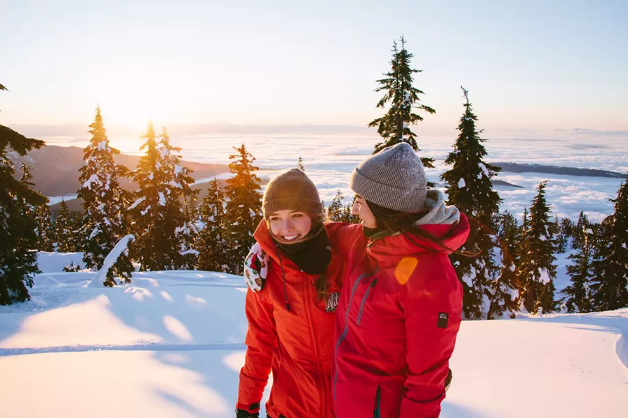 Two Friends Smiling Snow Around Them