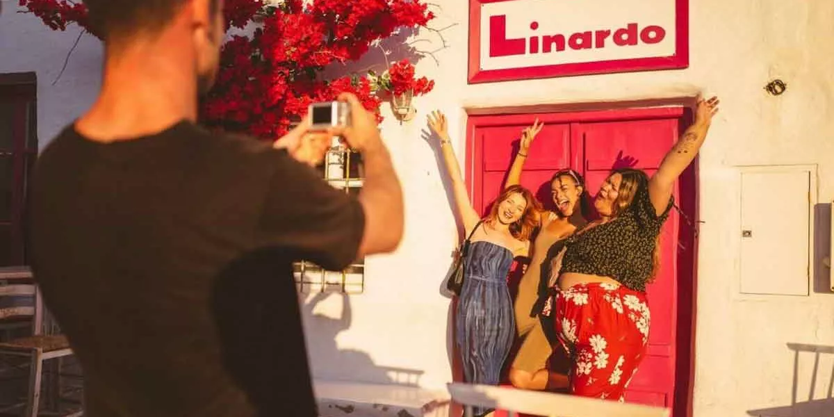 Group Of Travelers Taking Picture Of Eachother In Greece