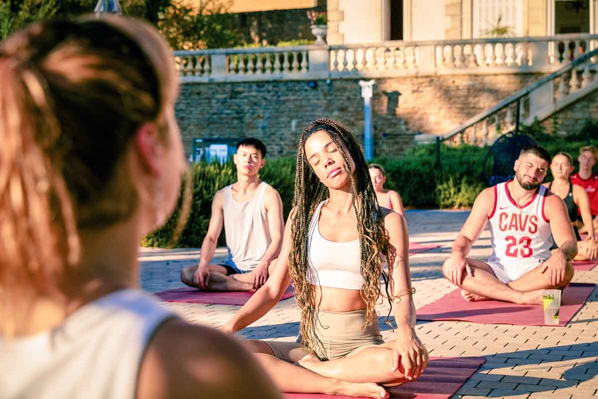 Group Enjoying Yogo Class Outside Chateau France 0691EURS2022