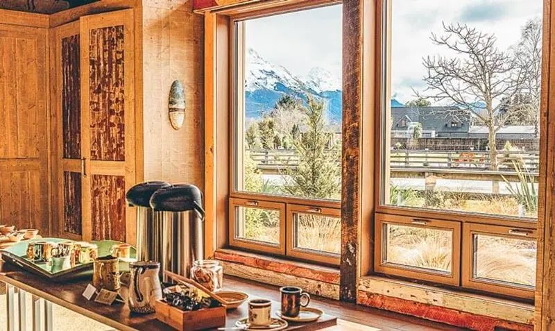 A wooden kitchen with a view to mountains