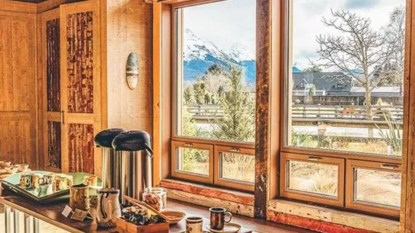 A wooden kitchen with a view to mountains