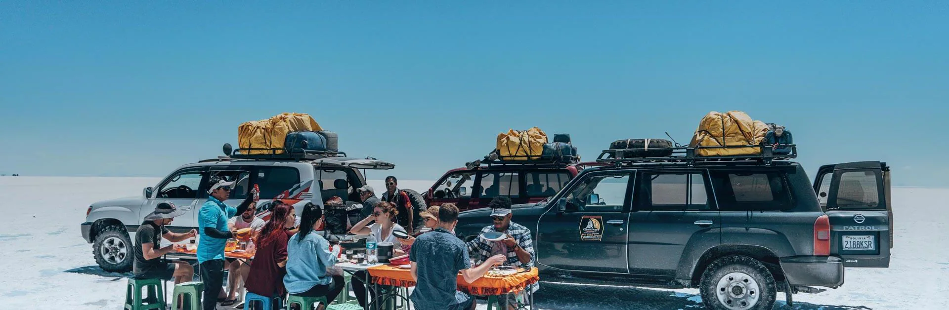 Travellers having dinner on trail