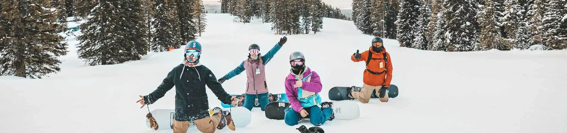 Snowboarders On The Snow In The Mountains