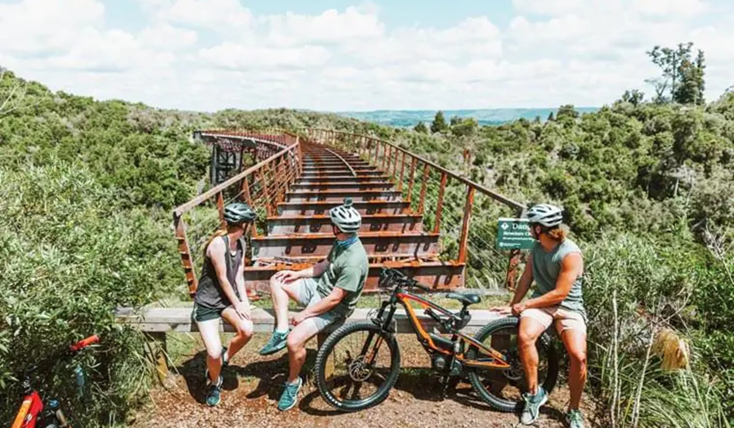 Group of people with bicycles near Old Railway Mt Ruapehu, New Zealand
