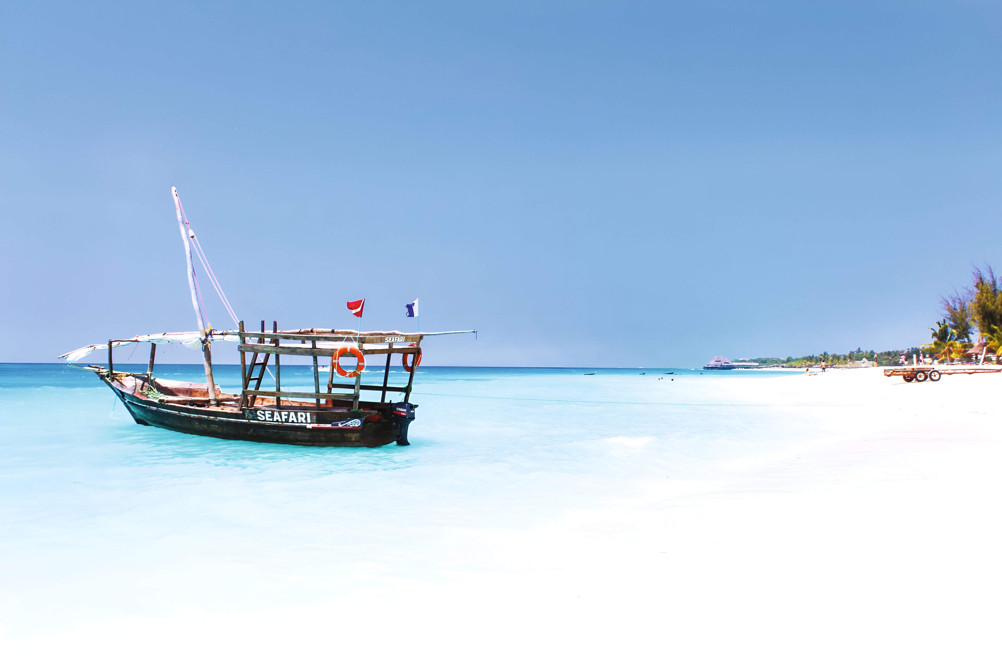 Sea boat safari on light blue sea in Tanzania.
