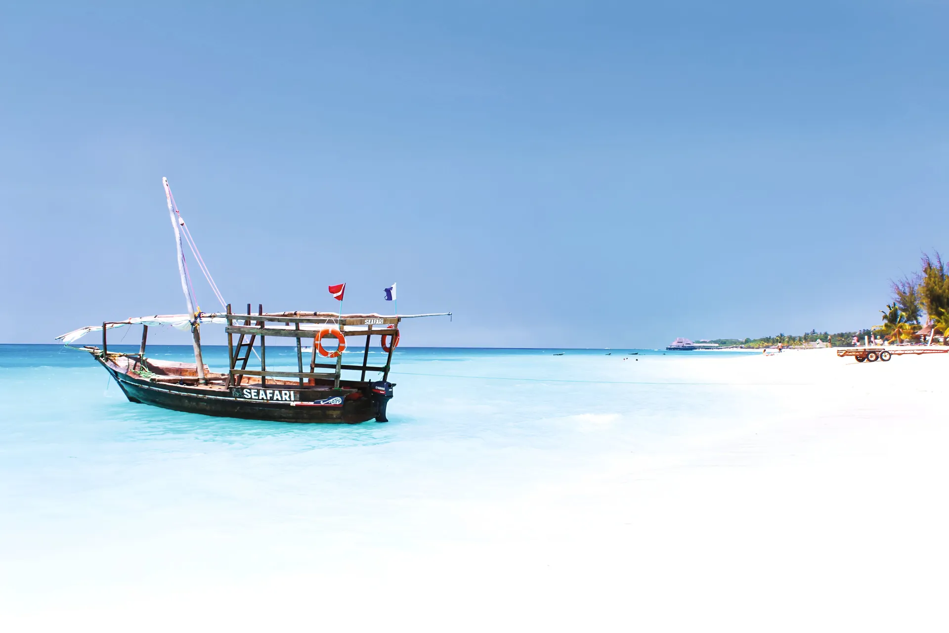 Sea boat safari on light blue sea in Tanzania.