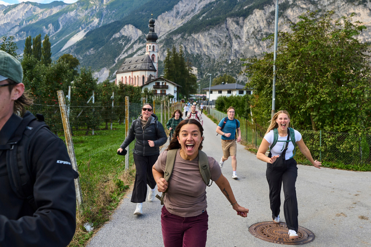 Group Running Through A Street In Innsbruck Austria