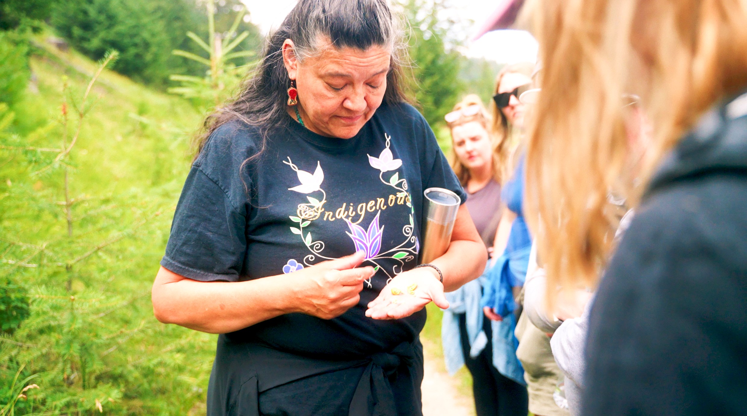 Warrior Women Host Demonstrating to Travellers During Plant Walk, Jasper, Canada