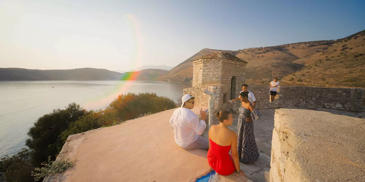 Group Of Young Travelers Exploring Porto Palermo Albania