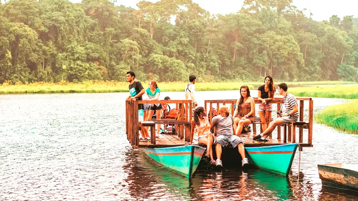 Travellers on a boat in Puerto Maldonado, Peru