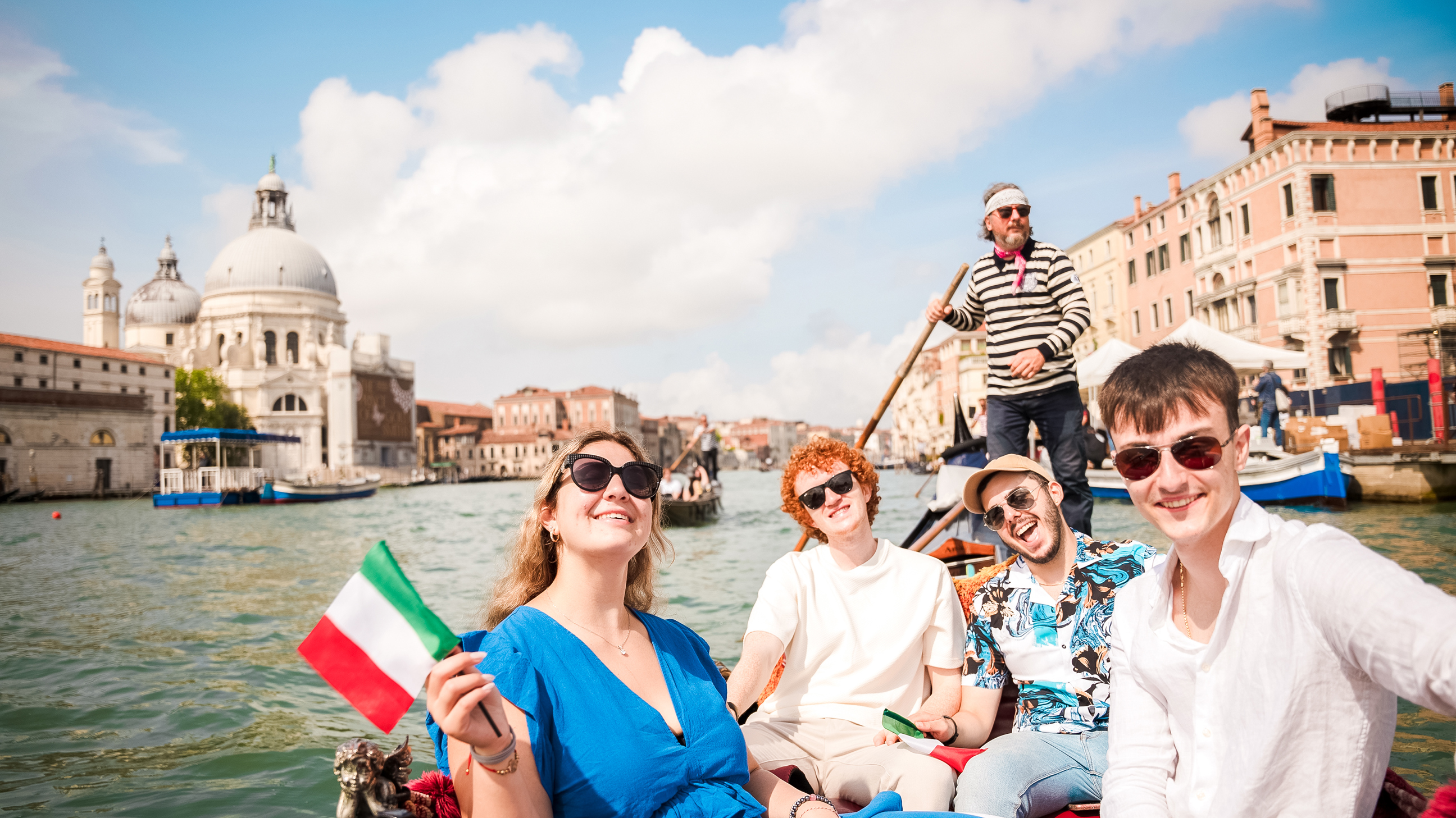 Travellers on a gondola ride in Venice, Italy