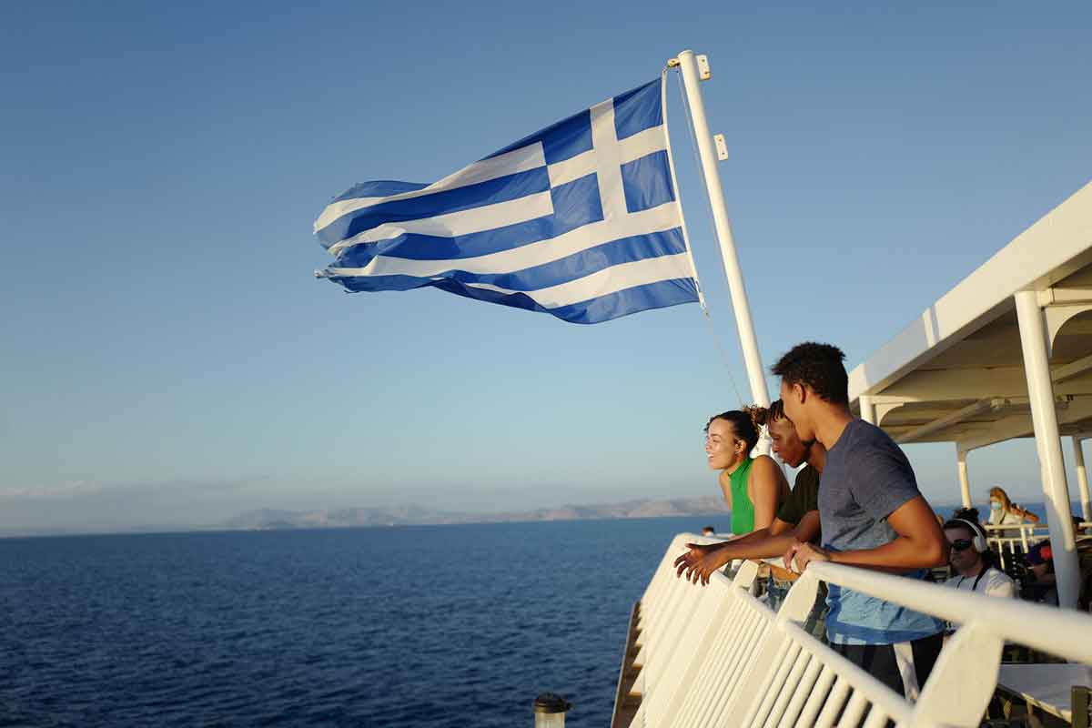 Greek Flag Travelers On Boat Greece