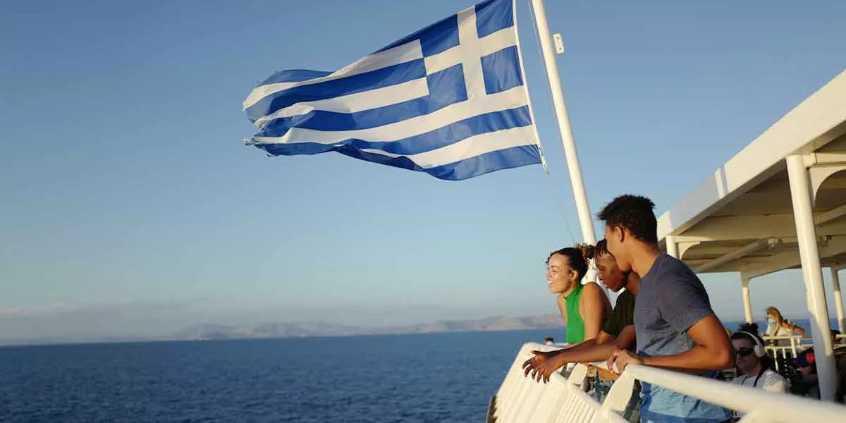 Greek Flag Travelers On Boat Greece