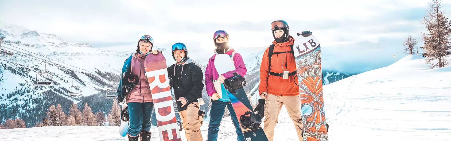 Group Of Snowboarders In Canada Mountains Hero 0002AMER2020