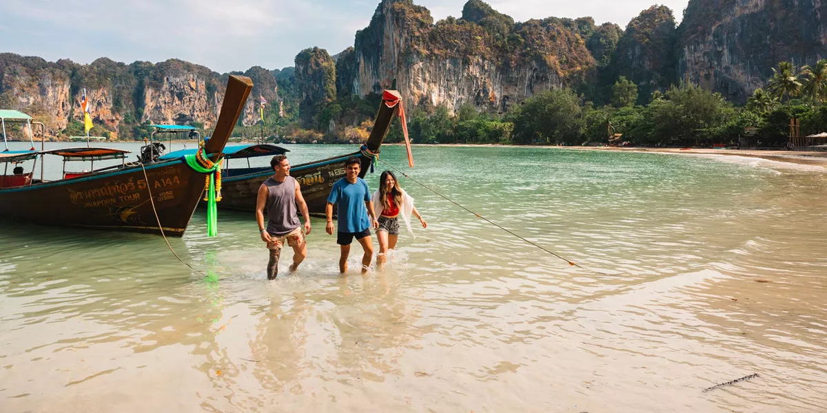 Three Friends Walking Out Of The Sea Sunny Day