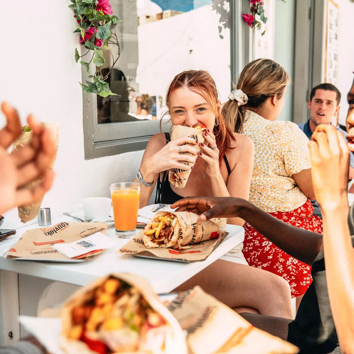 Young Woman Enjoyingl Greek Food