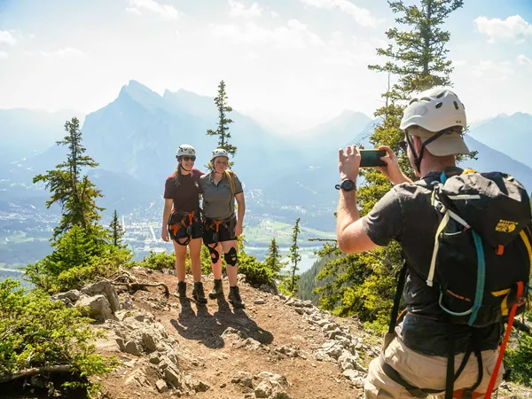 Group Of Adventures Taking Photo On Mountain In Canada