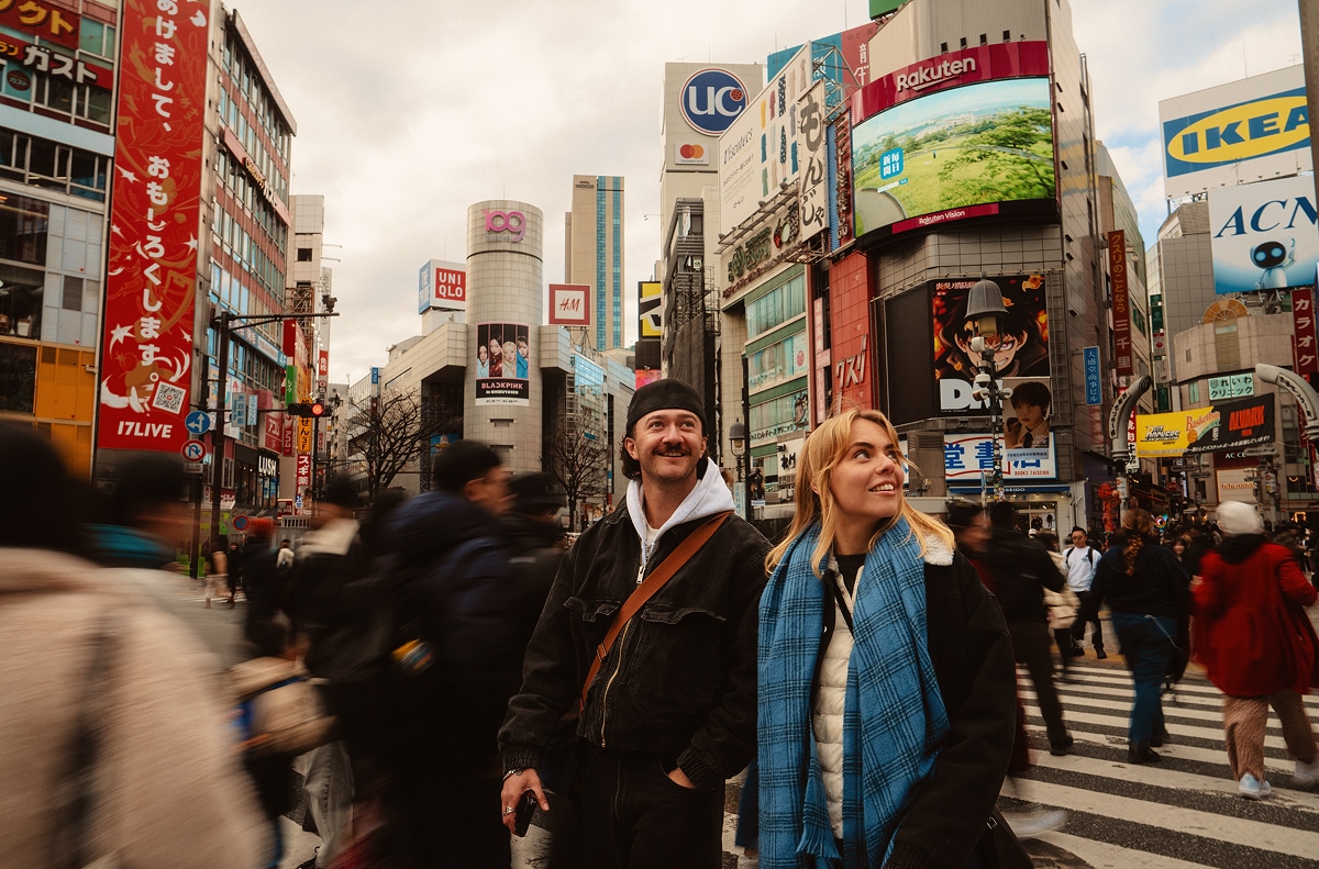 Couple Exploring Shibuya Crossing Tokyo Japan