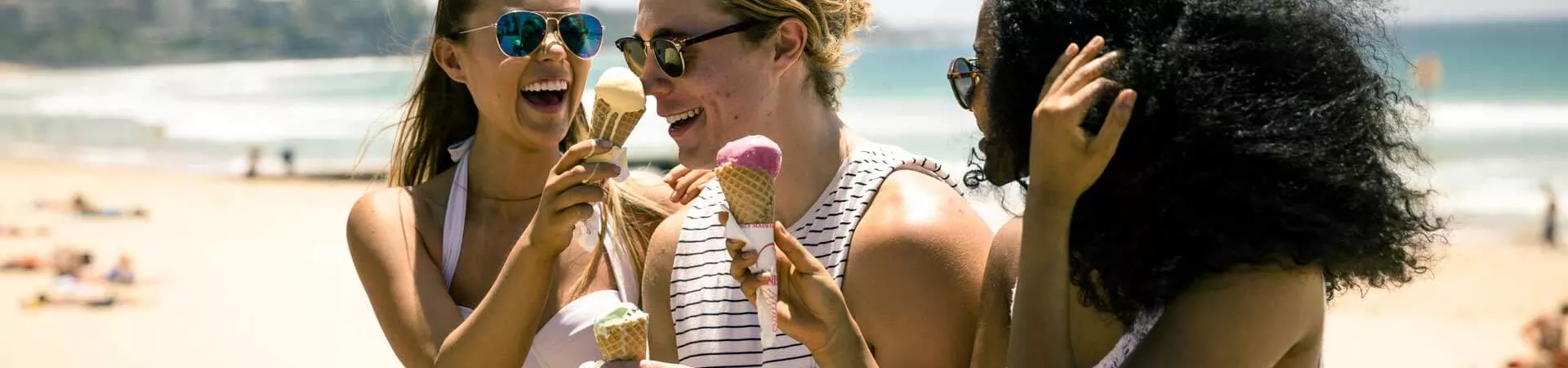 Group Near The Beach In Australia Eating Ice Creams