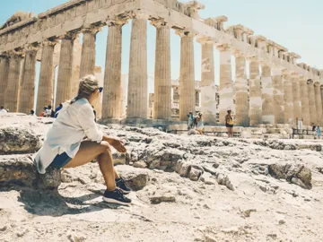 Contiki traveller admiring the Parthenon atop the Acropolis in Athens, Greece, on the Ultimate European Plus Egypt Tour