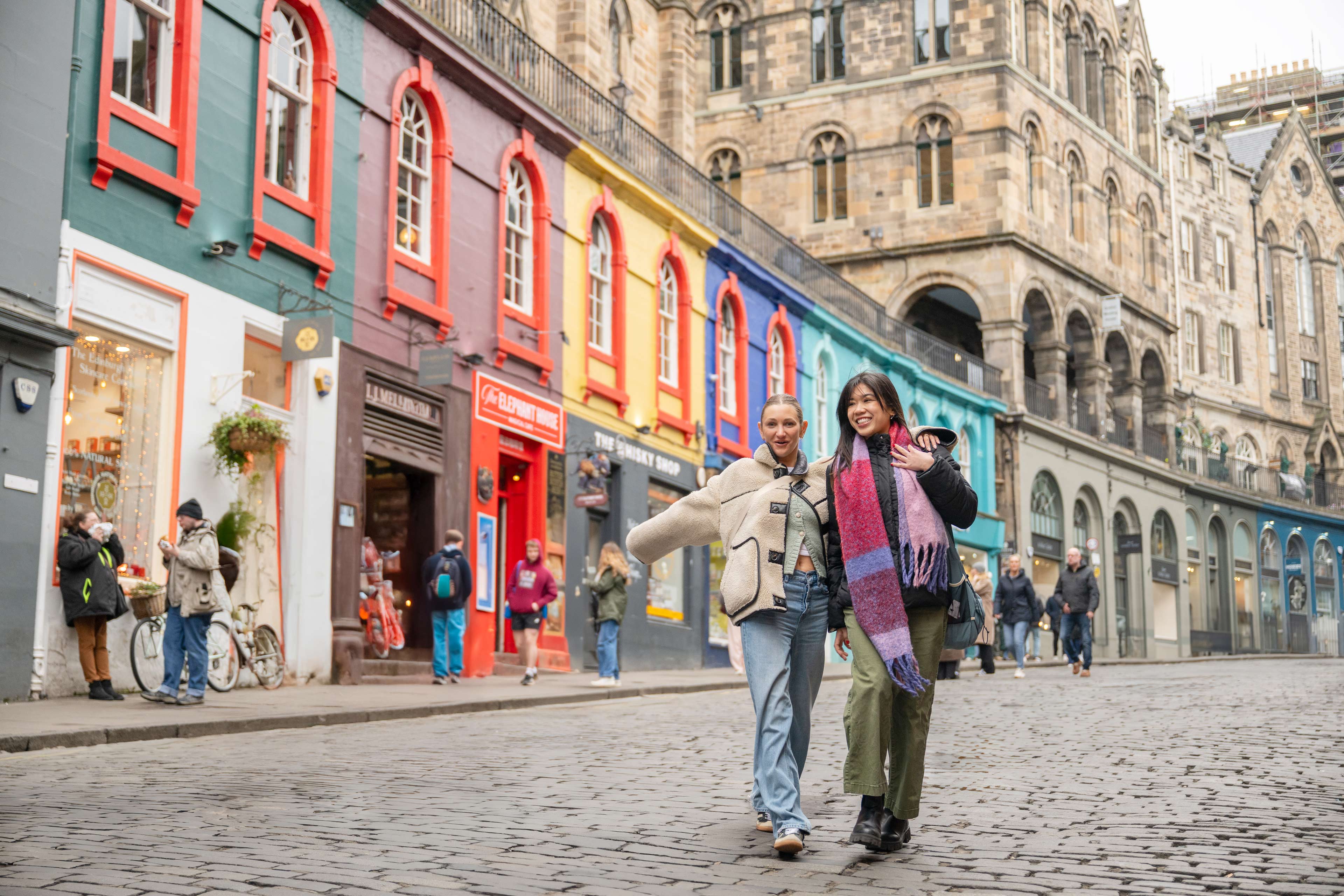 Friends Walking Through Edinburgh Streets